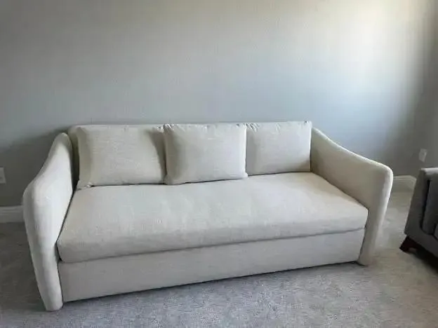 Clean upholstered sofa after professional cleaning