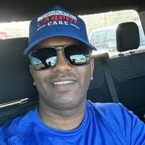 Complete Carpet Care team member in a branded cap