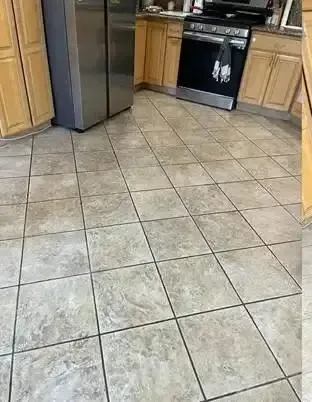 Kitchen tile floor with dark grout before professional cleaning, Complete Carpet Care tile and grout cleaning in Lakeland, FL